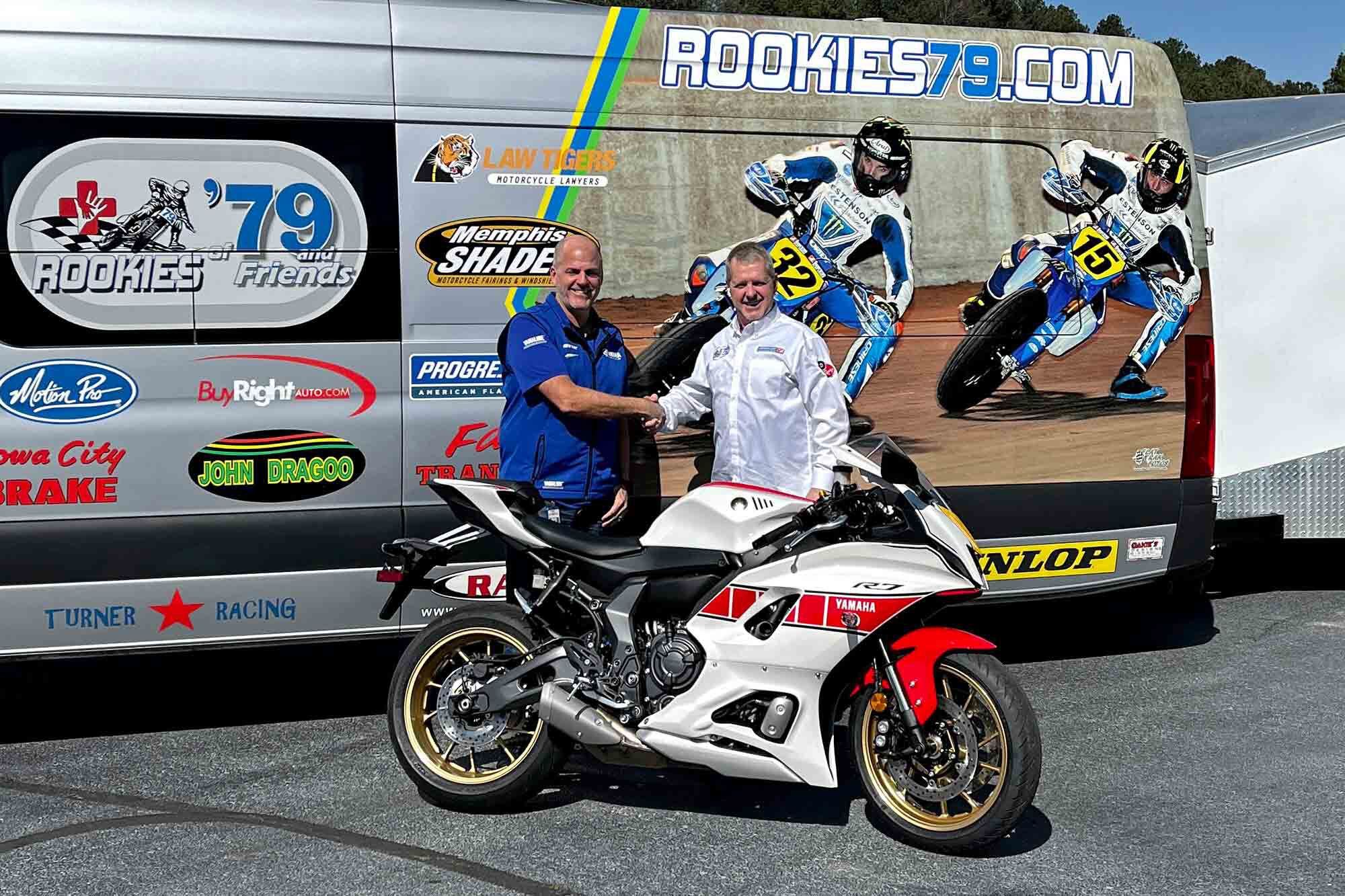 Yamaha Motorcycle Product Line Manager Derek Brooks and Rookies of ’79 Executive Director Charlie Roberts show off the R7 clothed in 60th Anniversary livery.