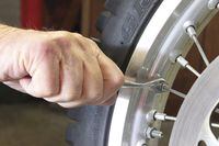 Tighten a loose spoke on your motorcycle Cycle World