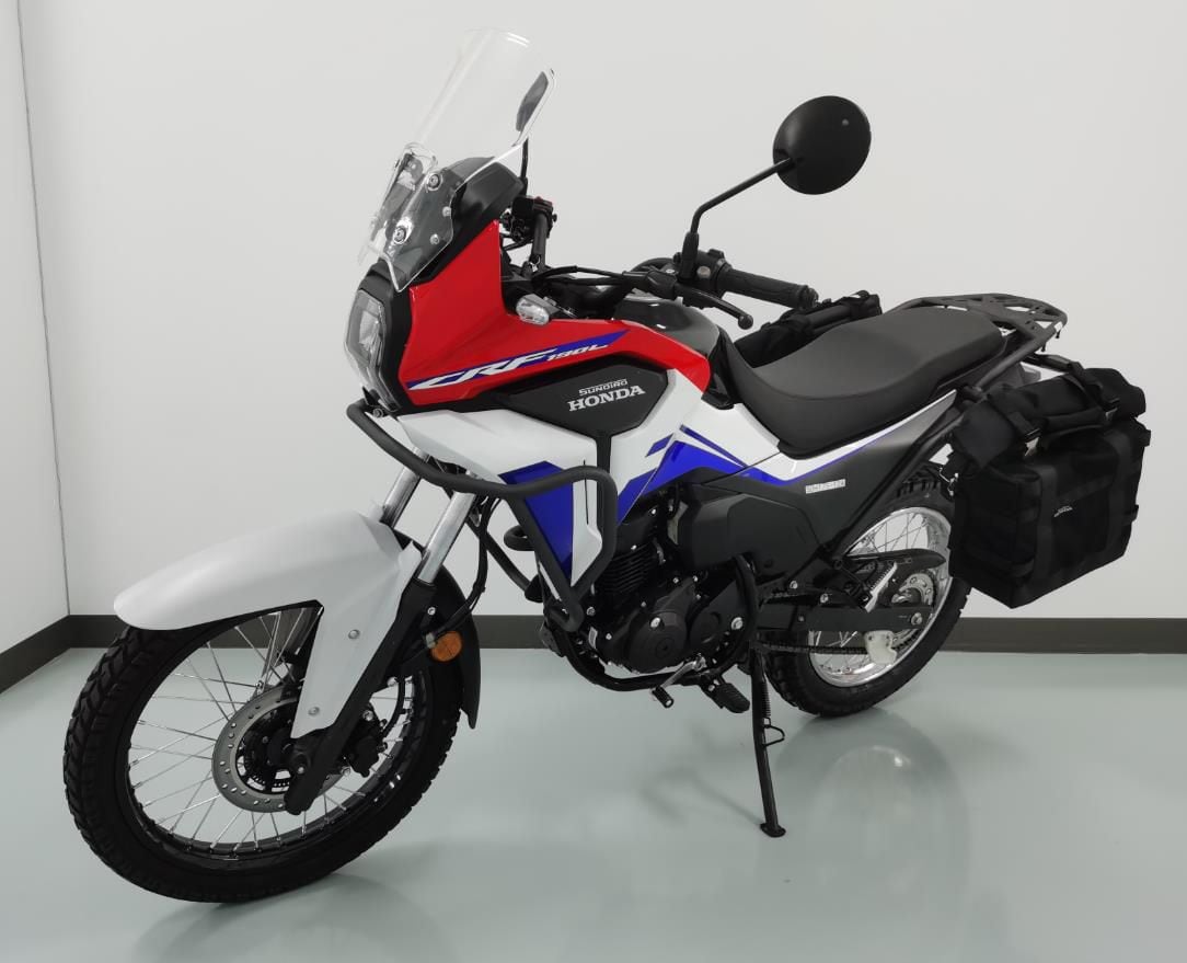 Added bodywork on the CRF190L means it’ll weigh substantially more, even before you factor in the optional soft luggage seen here.
