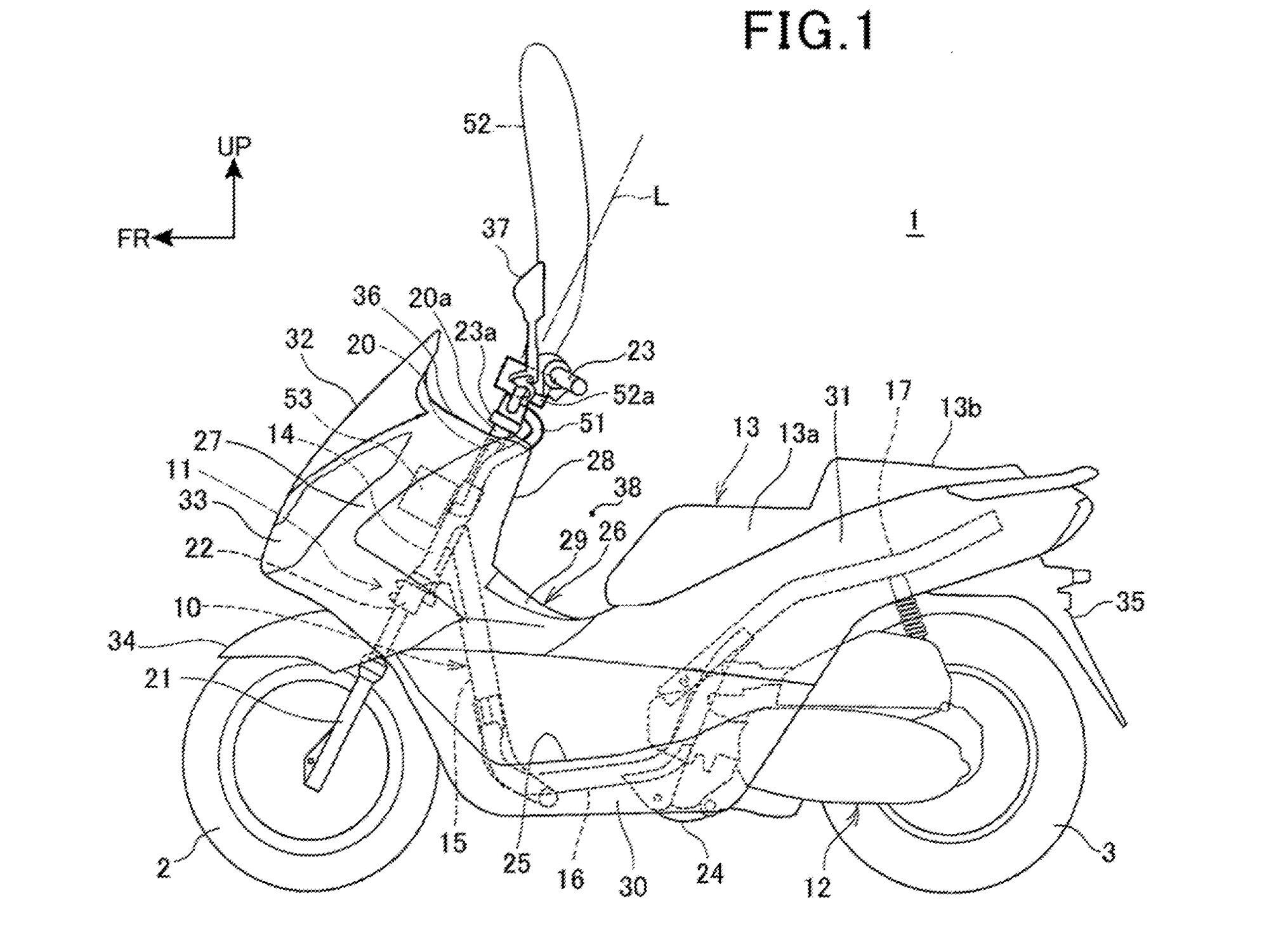This third patent also has the explosive inflator located down on the steering head away from the rider. Again, the bag deploys directly upward in front of the rider.