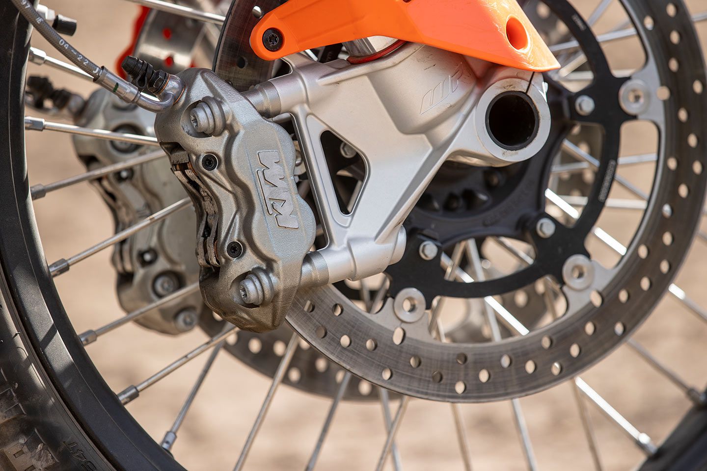 Twin 320mm discs are pinched by radial-mount, four-piston calipers.