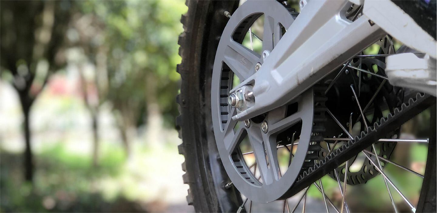 A Gates Mudport rear sprocket on a knobby-shod application. Width of the belt helps with shock load as might be encountered with jump landings or the slip-and-grip found off-road. IC engine power pulses also count as shock load.