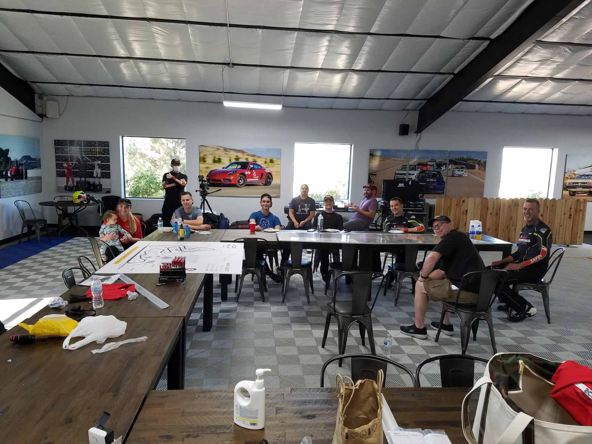 The gang assembles for the first time in Inde Motorsports Ranch’s garage, including Elena Meyer’s newly minted daughter (left). Five days later we would have a mountain of riding information…14 months later it would be ChampU.