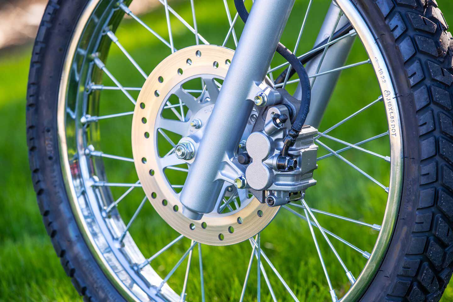 The front brake features a 240mm slotted disc and dual-piston caliper.