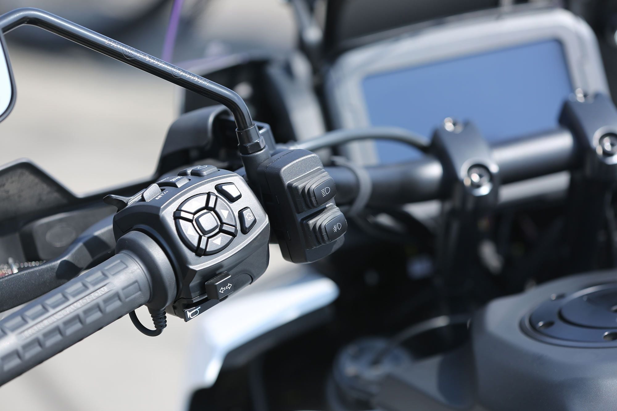 Controls for the flashing lights are mounted to the Pan America’s handlebars.