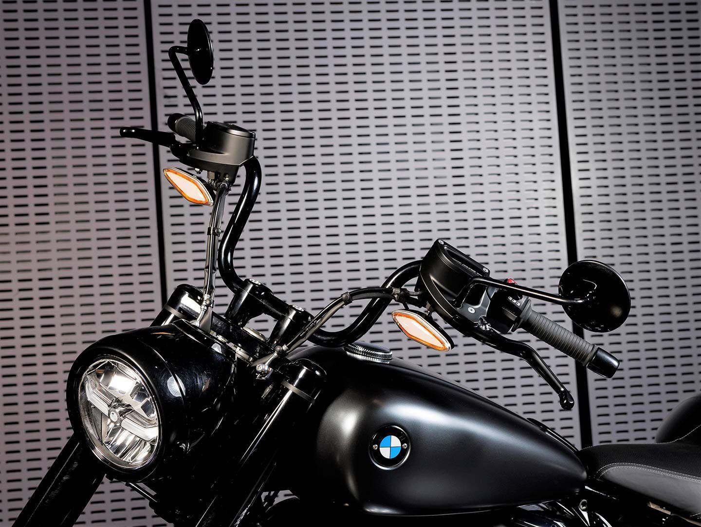 The taller, black-coated handlebars provide mounting points for the front turn signals.