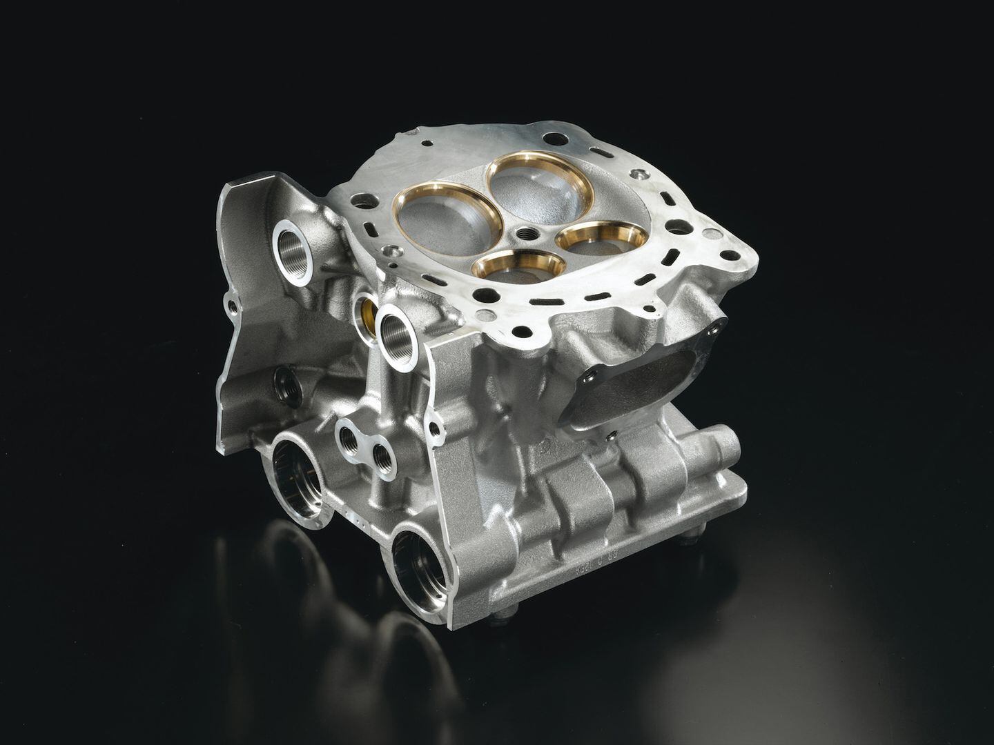 Production engines receive three-angle valve jobs with 15 degrees of change per cut. Here beryllium-copper valve-seat rings are used to seal titanium valves.