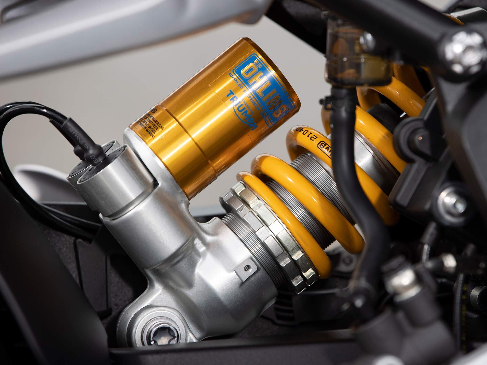 The Speed Triple 1200 gets Öhlins’ Smart EC 2.0 electronically adjustable semi-active suspension, front and rear.