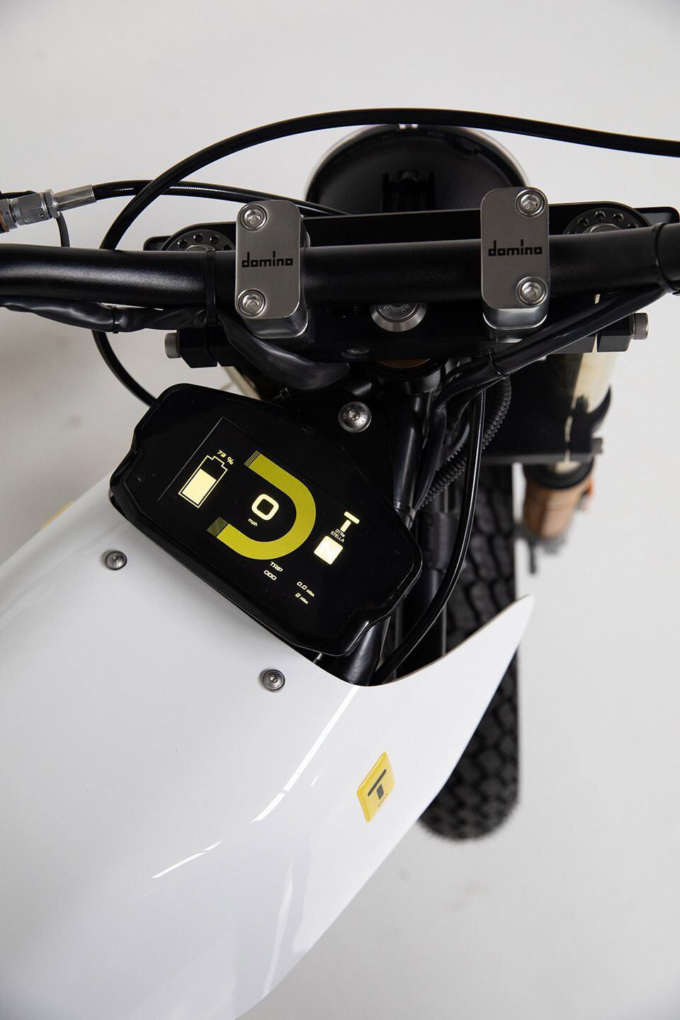 A cockpit view of the DTRe Stella, with a color dash displaying bike functions and battery status.