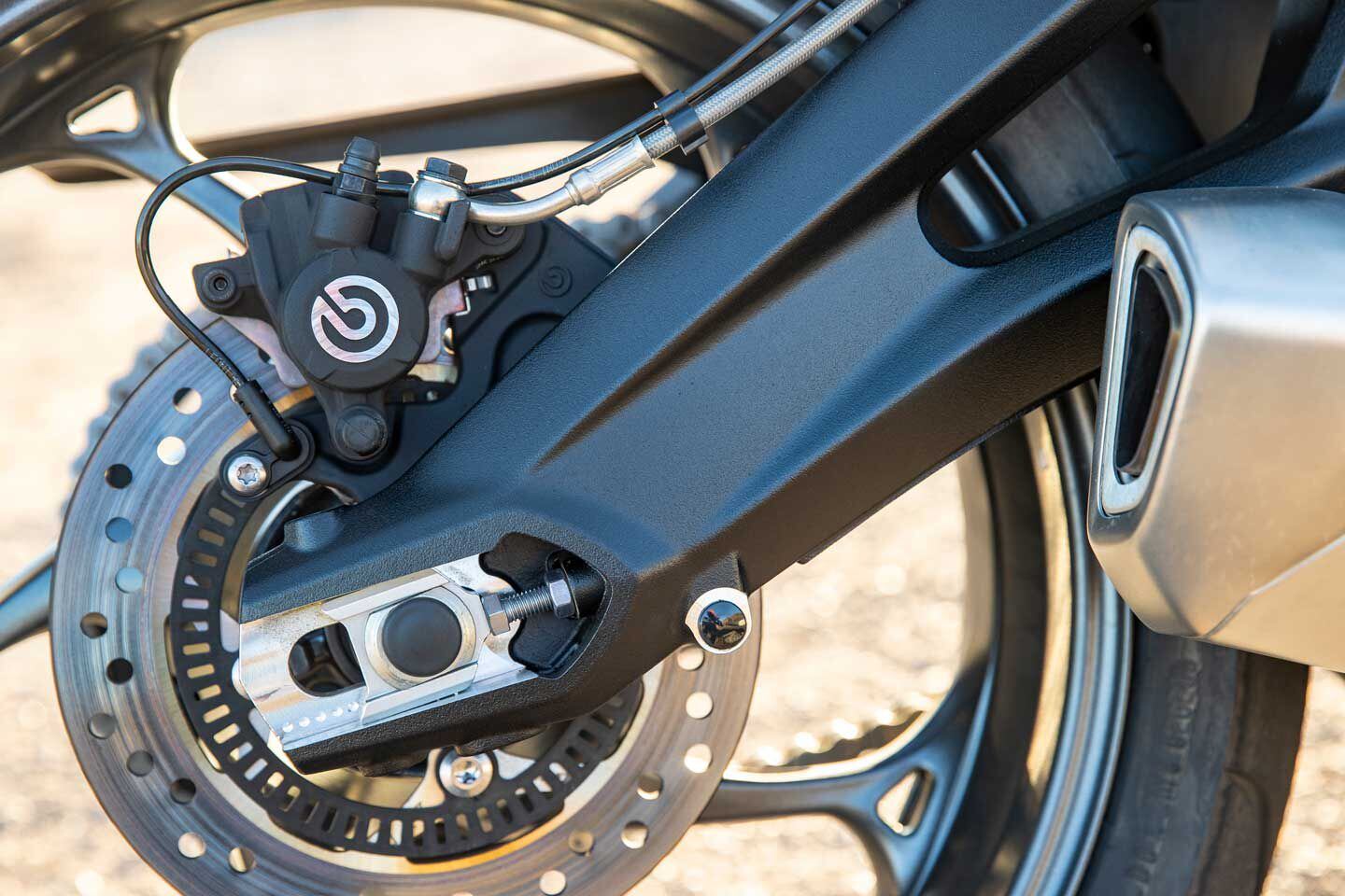 A curved aluminum swingarm is linked to a fully adjustable Showa shock.