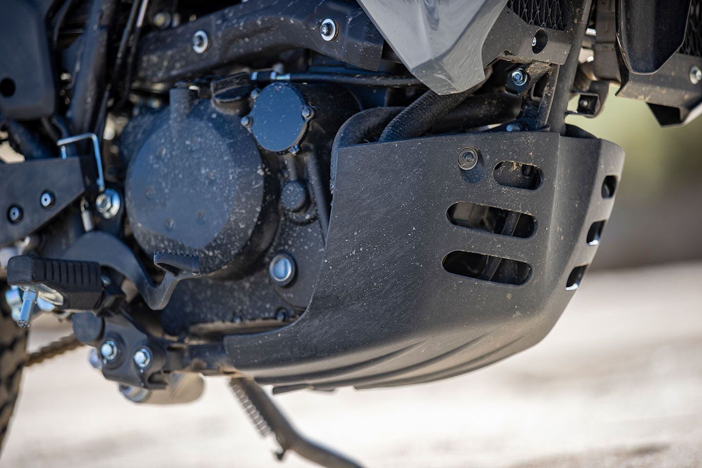 A plastic skid plate will help protect the precious under bits. Fortunately, it received zero action during my time on the bike.