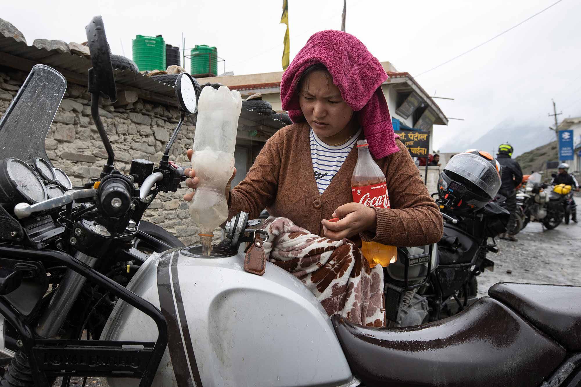 It’s common practice to purchase fuel in plastic drinking bottles. This “station” was full service.