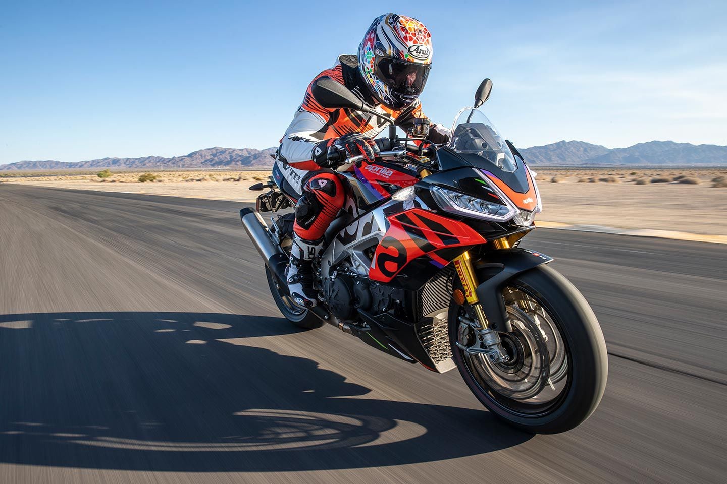 The Aprilia is basically a RSV4 with an upright bar and mellower engine tuning.