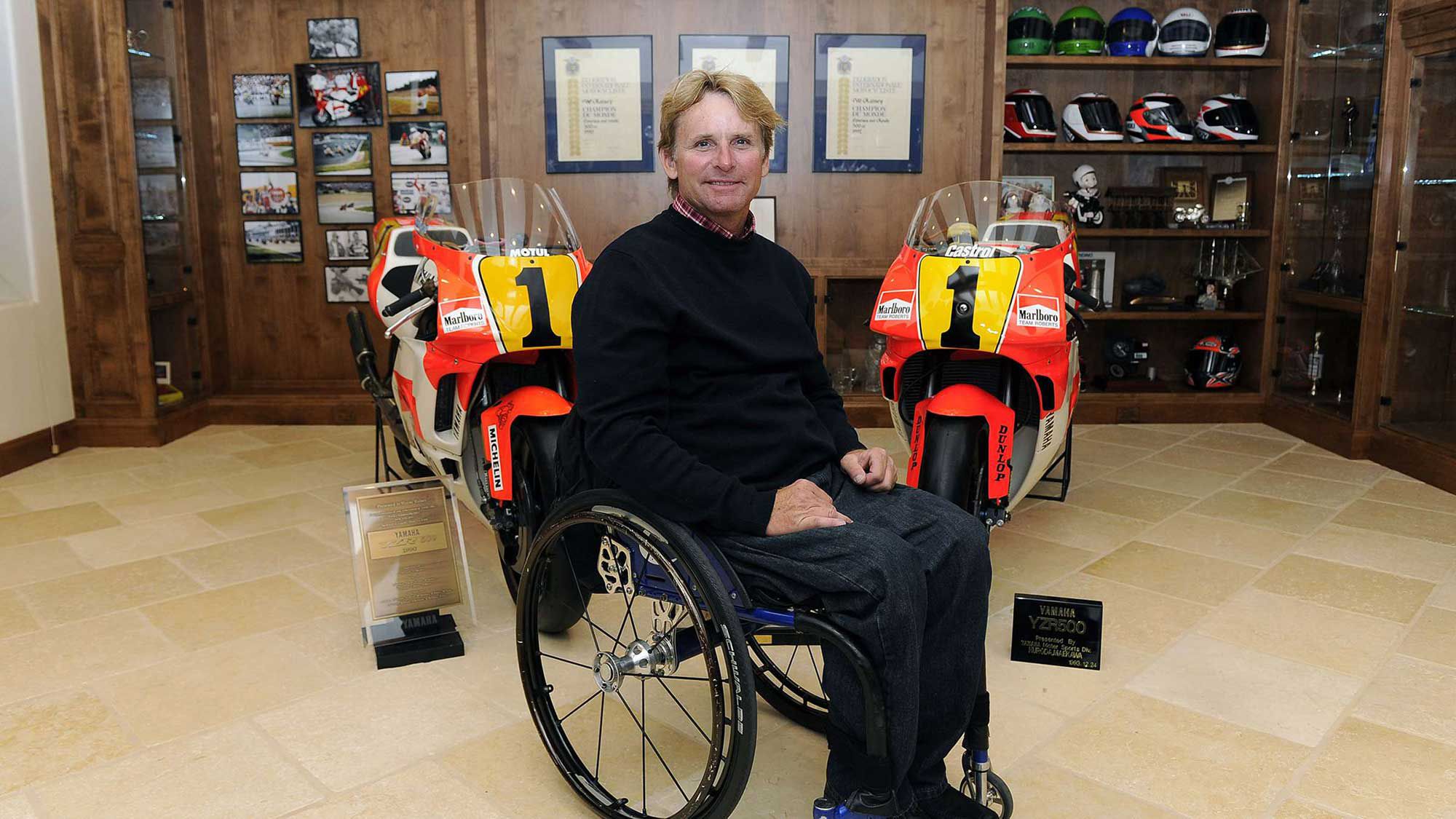 Rainey next to two of his championship-winning Yamaha YZR500 GP bikes.