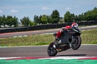 Ducati Panigale V2 wheeling on race track