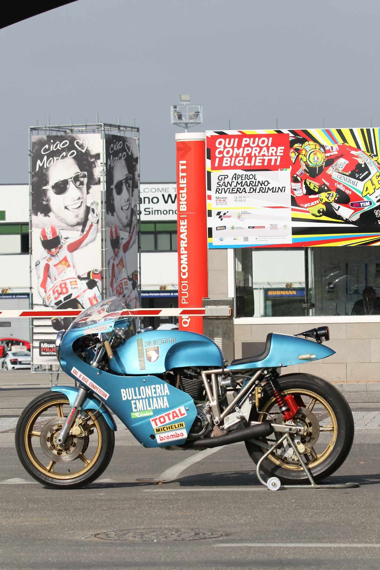The Eagle proved itself at no less of a track than the legendary Misano. In addition to being the bike’s current owner, Giancarlo Rossi is also the late Marco Simoncelli’s uncle. Note the Simoncelli tribute banner outside the Misano track today.