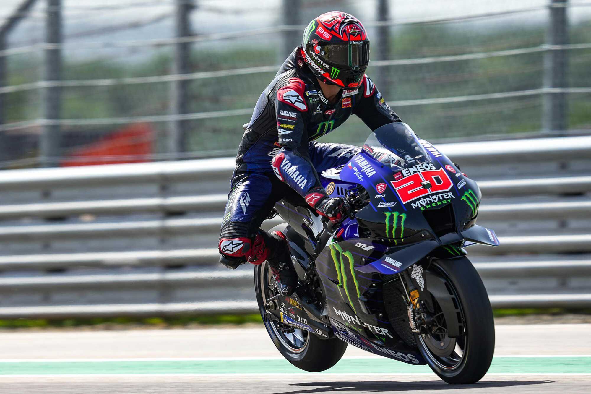 MotoGP racers routinely lift the rear tire off the pavement during braking; here Fabio Quartararo demonstrates at Germany’s Sachsenring.