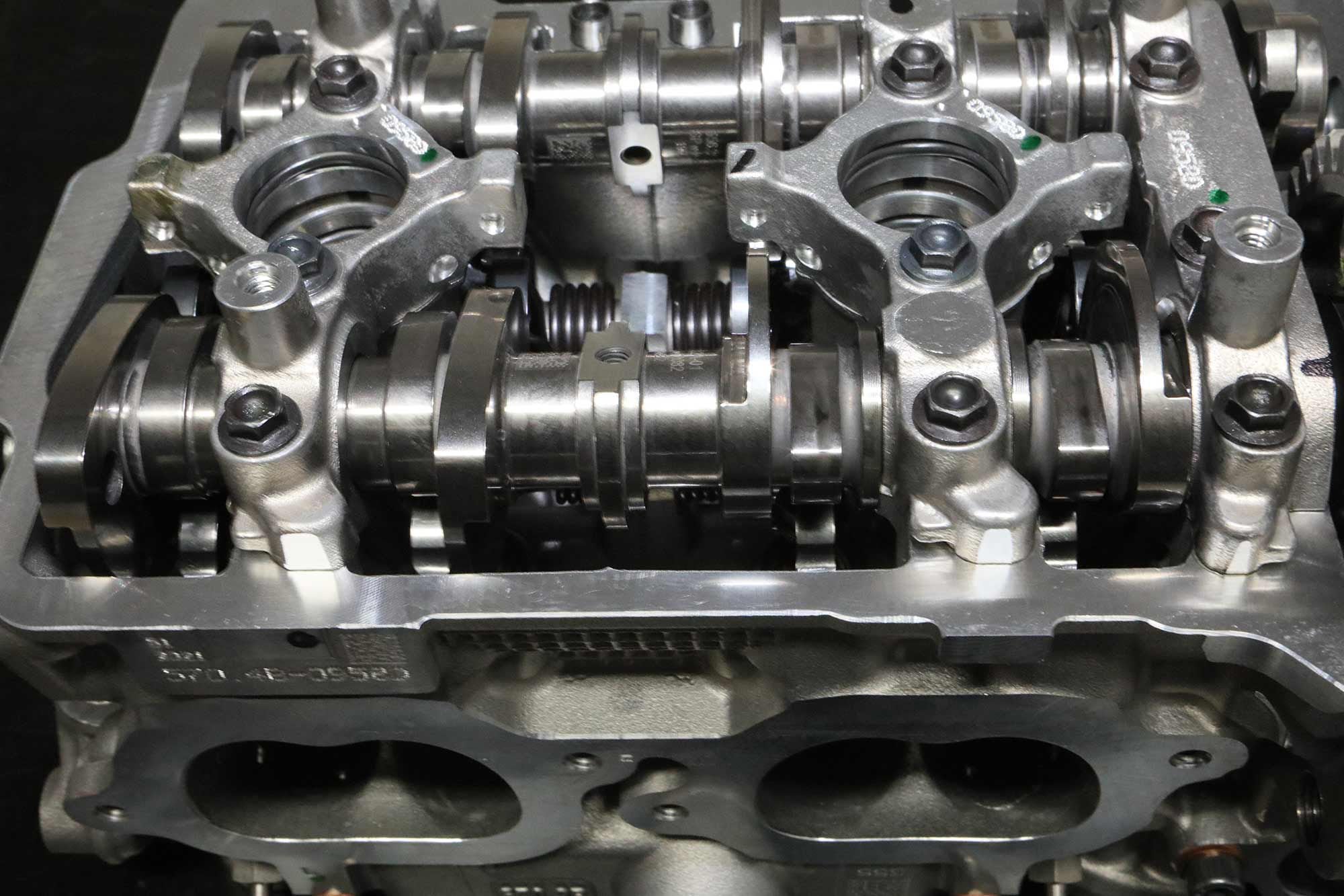 The Panigale’s desmo cambox is a busy place, crowded with two cam lobes for each valve and their related finger-type opening and closing followers.