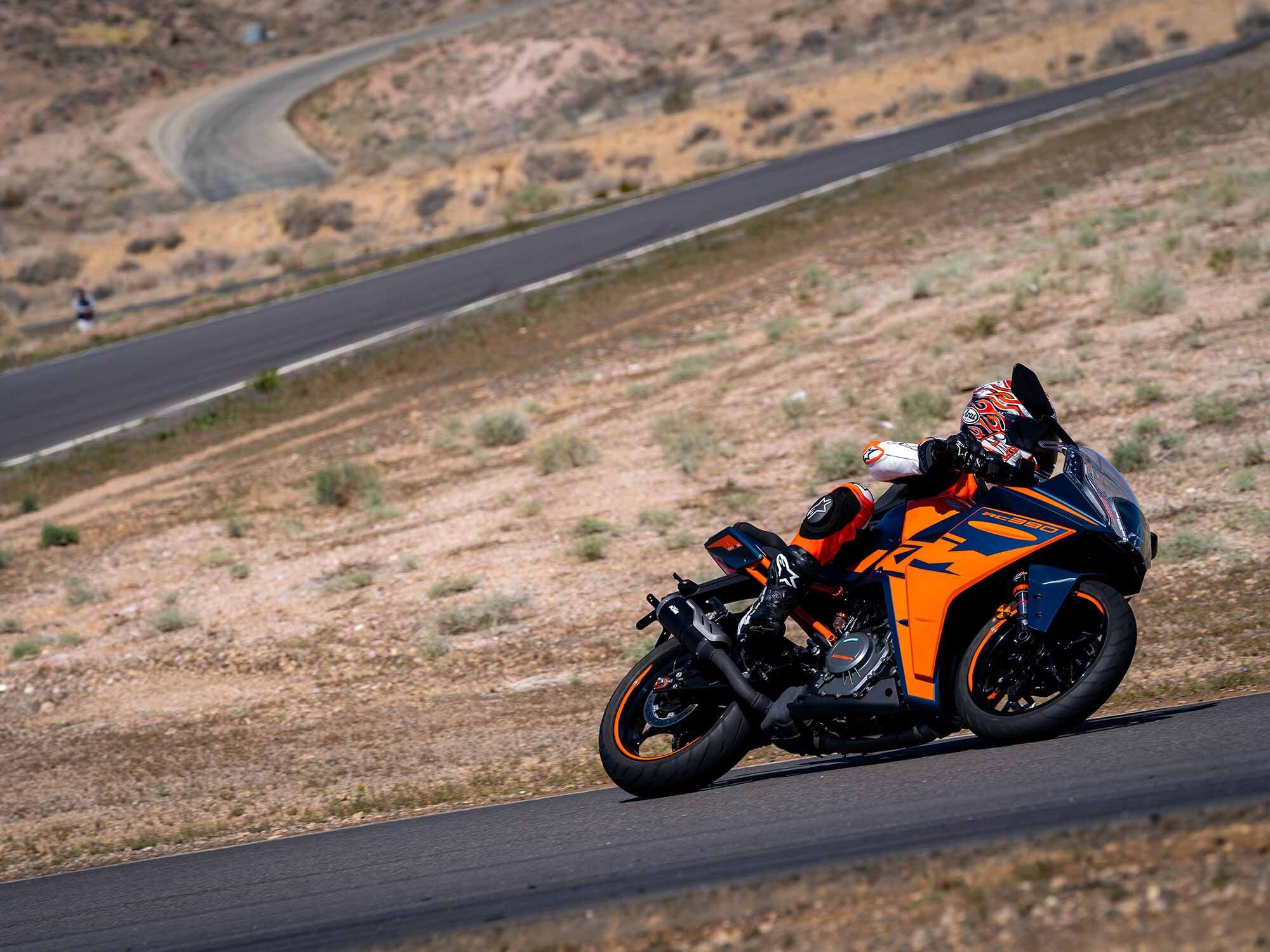 The KTM RC 390 confidently smashes apexes, but scrapes its footpegs at serious lean.