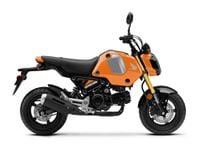 2024 Honda Grom Nitric Orange colorway studio right side profile