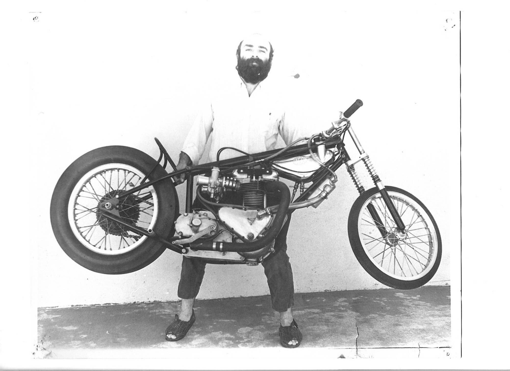 Where do you want this thing? Sandy with an early-days lightweight Triumph 650 drag bike. Is that an Avon slick?