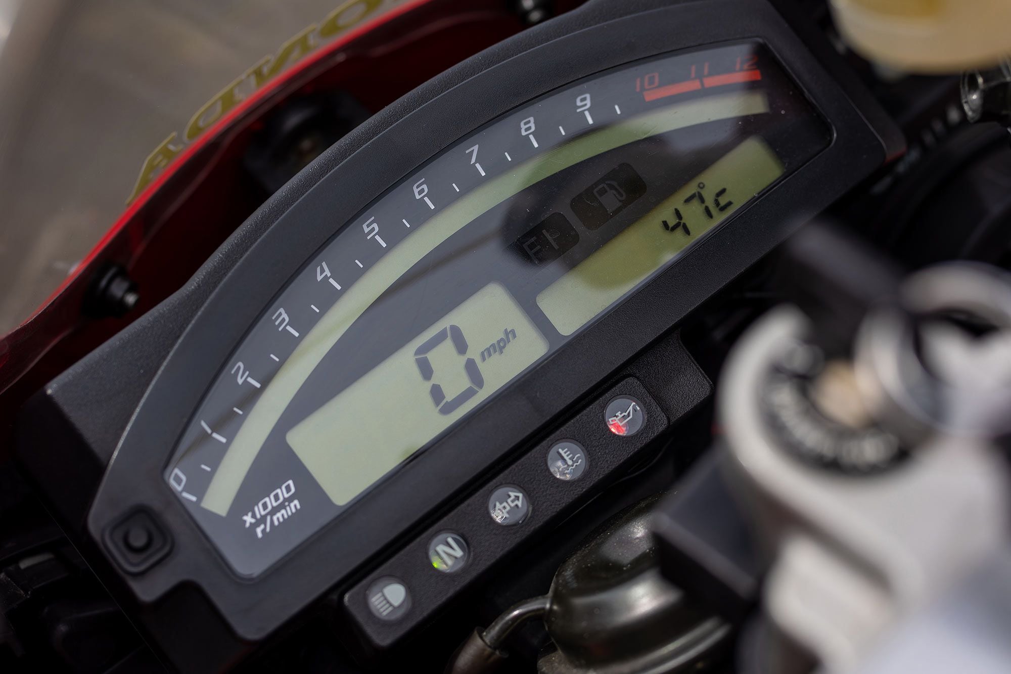 A digital rev counter dominates a straightforward and simple dash on the RC51.