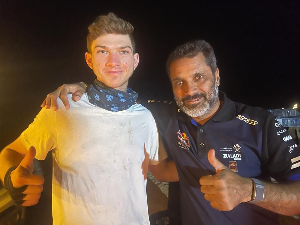 Mason Klein takes a break for a picture with Dakar car legend Nasser Al-Attiyah. Klein’s race would be over the next day.