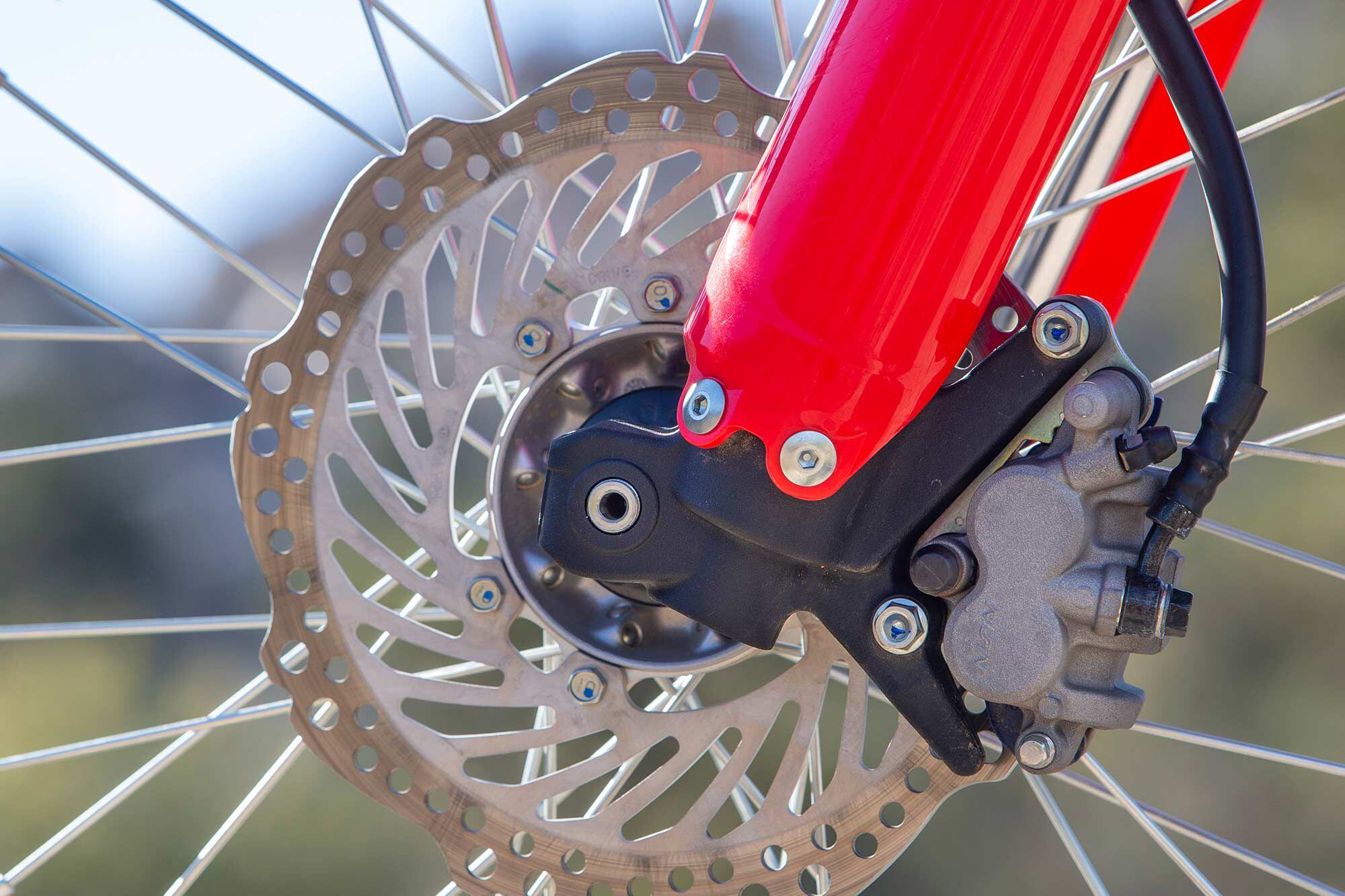 Despite having a Nissin two-piston caliper and 256mm disc (just 4mm smaller than Honda’s motocross and off-road models), the CRF300L’s front brake leaves something to be desired. It’s not strong or progressive enough for our liking.
