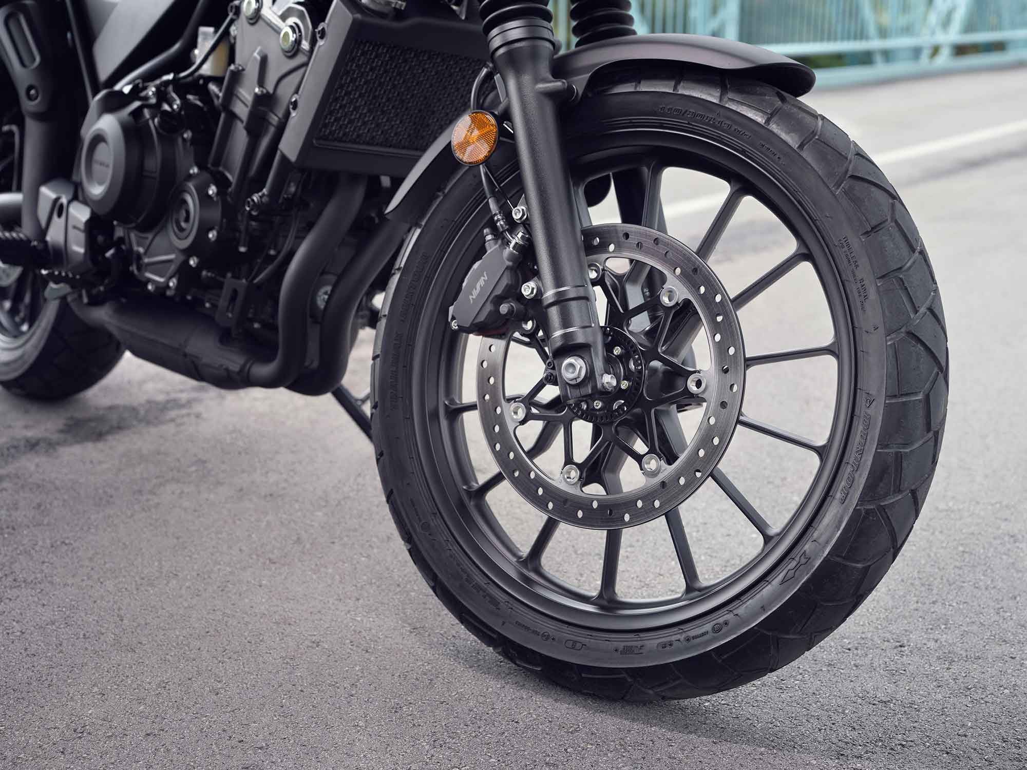 The front end has a standard, upright fork, a single twin-piston brake caliper and disc.
