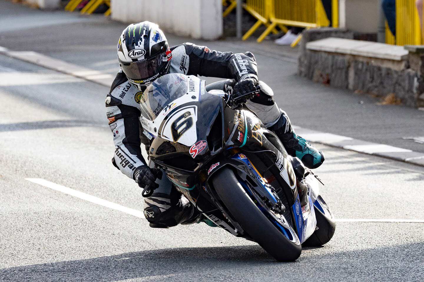 Nineteen-time TT winner Michael Dunlop rides his Suzuki 1000 Superbike into Parliament Square in Ramsey.