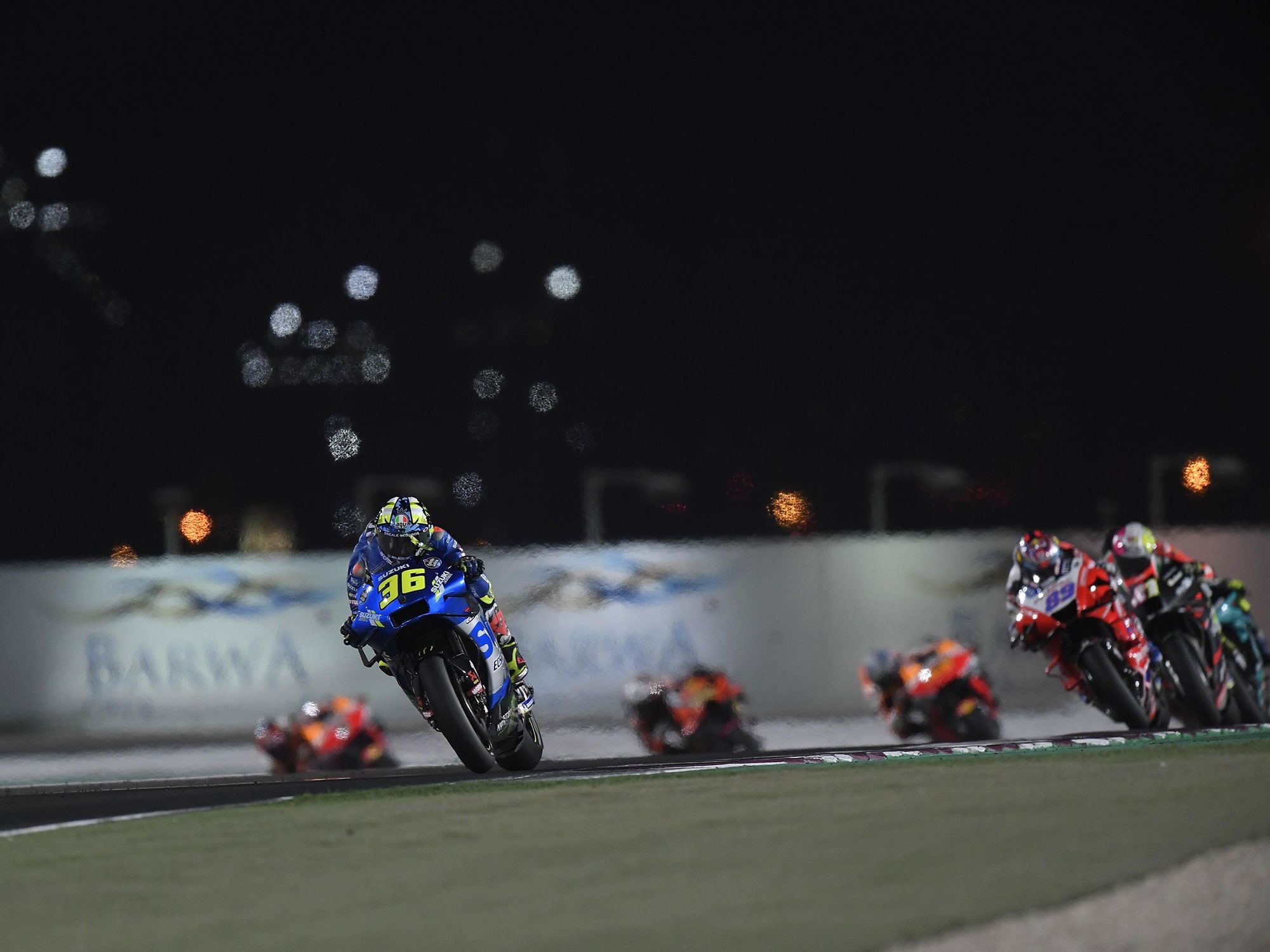 Joan Mir pushed from a tenth-place start and moved to second on the last lap, but the Ducatis of Johann Zarco and Pecco Bagnaia powered past on the front straight relegating Mir to a fourth.