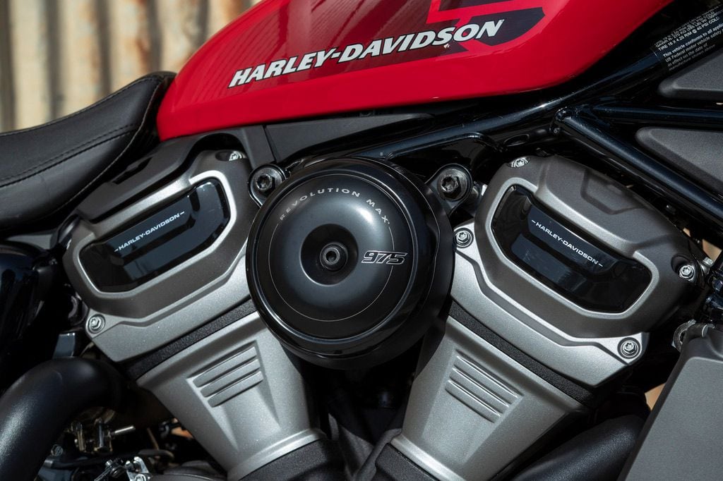 What looks like an air filter cover is just a styling piece covering the intake port that leads to the airbox above.