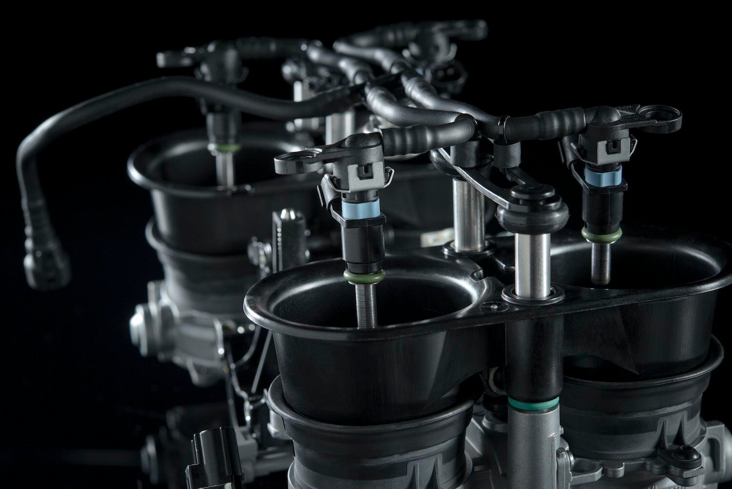 Turn key, push button, easy peasy: Ducati’s motor-driven dual-length intake system, as seen on the Euro 4-compliant Panigale V4. When the four bellmouth extensions are raised, intake length becomes 25mm shorter.