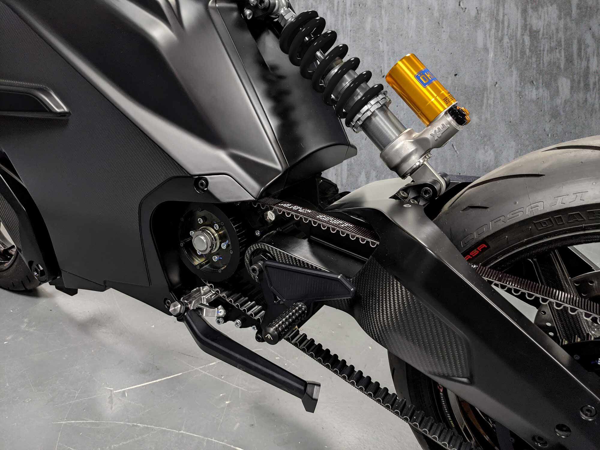 Final drive is now a belt instead of the previous chain spec, though the rear carbon swingarm remains. Motor and single speed transmission is integrated into the rear end.