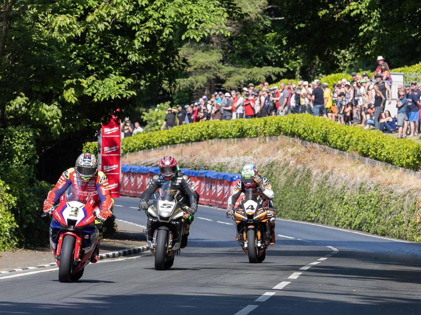 Although riders start at 10-second intervals, it doesn’t take long for traffic to build up. Approaching the Ramsey Hairpin, John McGuiness on this factory-sponsored CBR1000RR-R SP Fireblade leads James Hillier on his OMG Racing Suzuki Superbike, both being chased by Jamie Coward, also riding a Honda.Although riders start at 10-second intervals, it doesn’t take long for traffic to build up. Approaching the Ramsey Hairpin, John McGuiness on this factory-sponsored CBR1000RR-R SP Fireblade leads James Hillier on his OMG Racing Suzuki Superbike, both being chased by Jamie Coward, also riding a Honda.