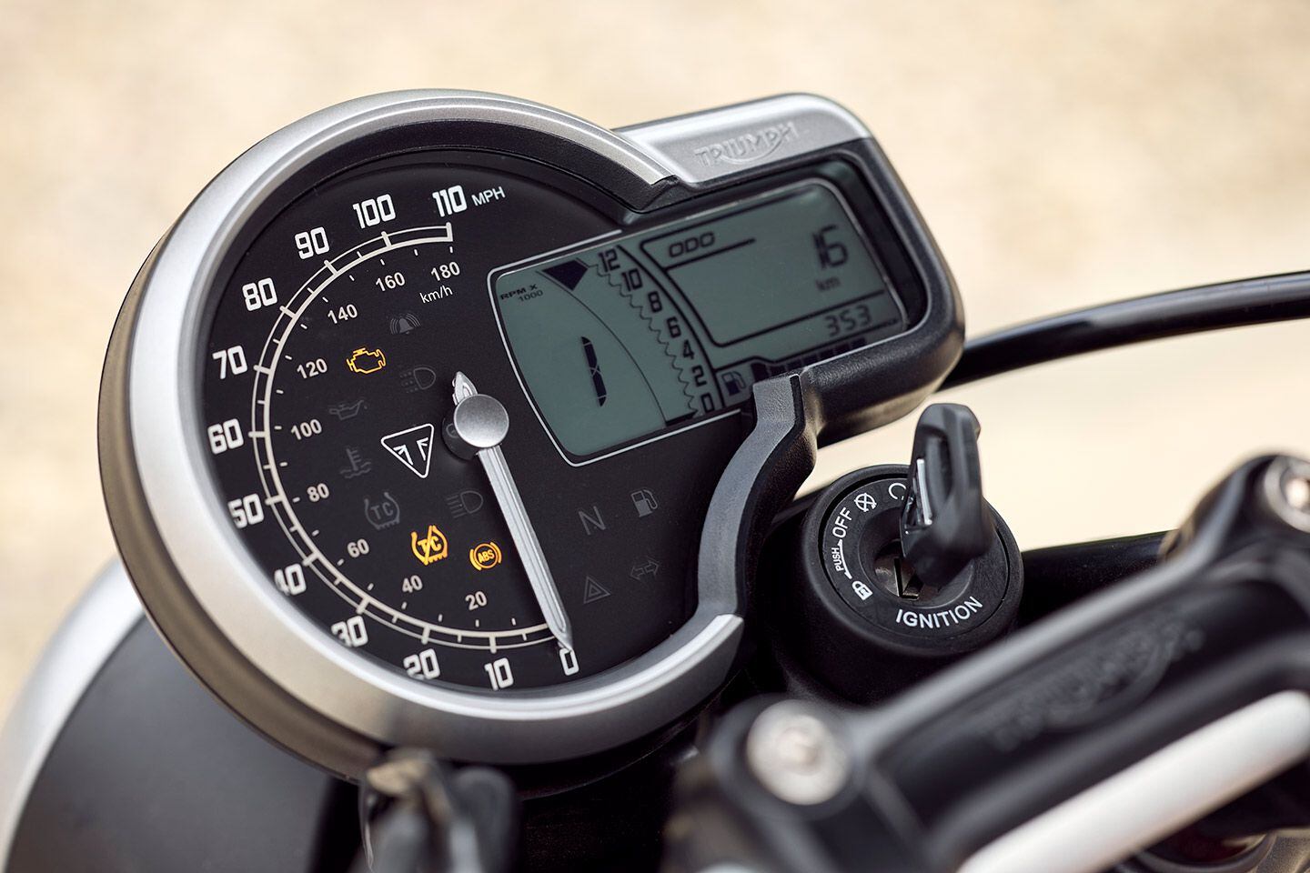 A digital and analog dash has a sweeping dial for the speedo but a digital tach.