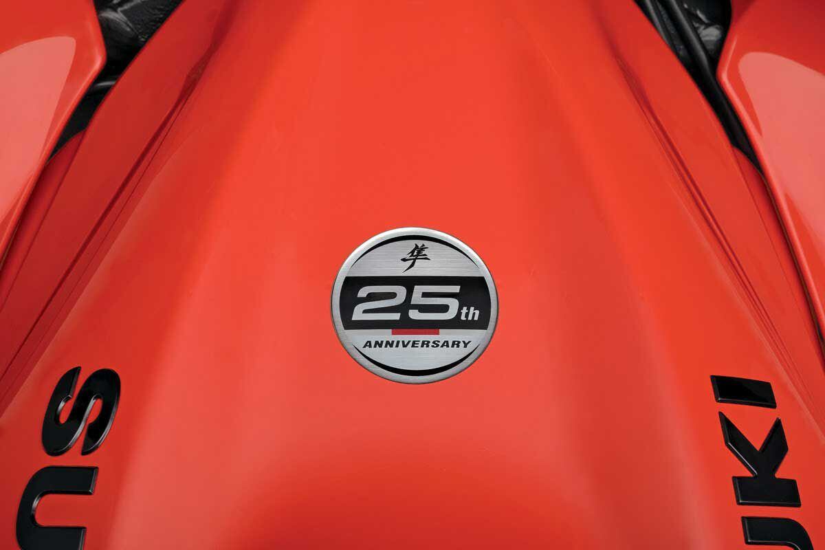 Special 25th-anniversary emblem takes a prominent place on the fuel tank, which also carries raised Suzuki logos on the sides.