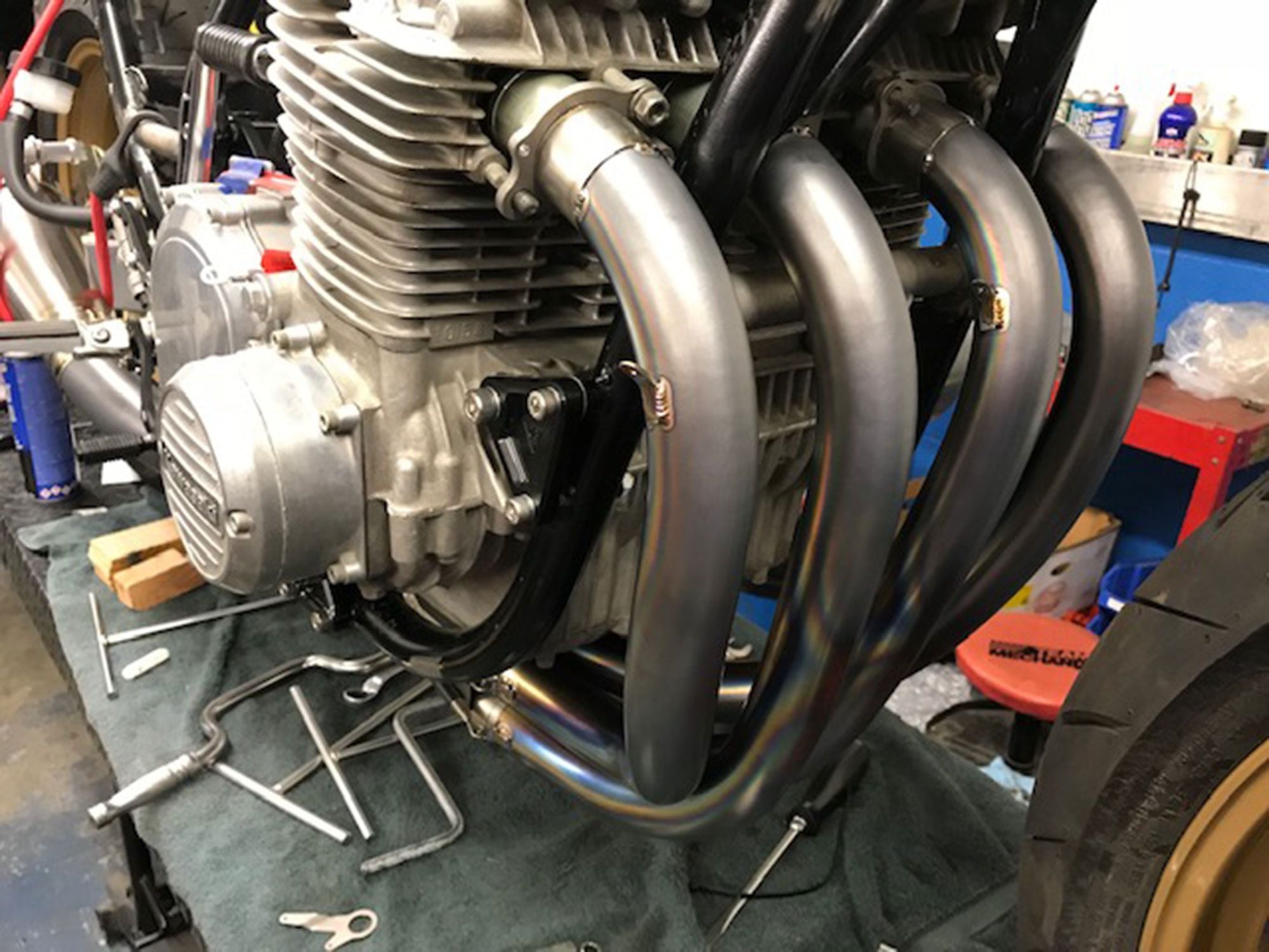Well before the frame was powdercoated gray, Andrew test-fitted the engine and JB Racing sand-bent titanium pipe. Don’t be misled by the stock-appearing engine cases—this KZ displaces 1,105cc with JE pistons coated by Millennium Technologies, with HyperCycle cams and springs opening stock valves. The stock roller crank was trued and welded by Falicon, and this KZ wears one of the last cylinder heads that the late Mitsu Kaneda ported to specs that HyperCycle utilizes. The stock shim-over-bucket system was replaced with a shim-under-bucket kit to keep shims from being spit out. APE provided the shim-under-bucket kit, the valve-spring retainers, and cam-chain tensioner. Andrew claims 125 hp from this streetable build.