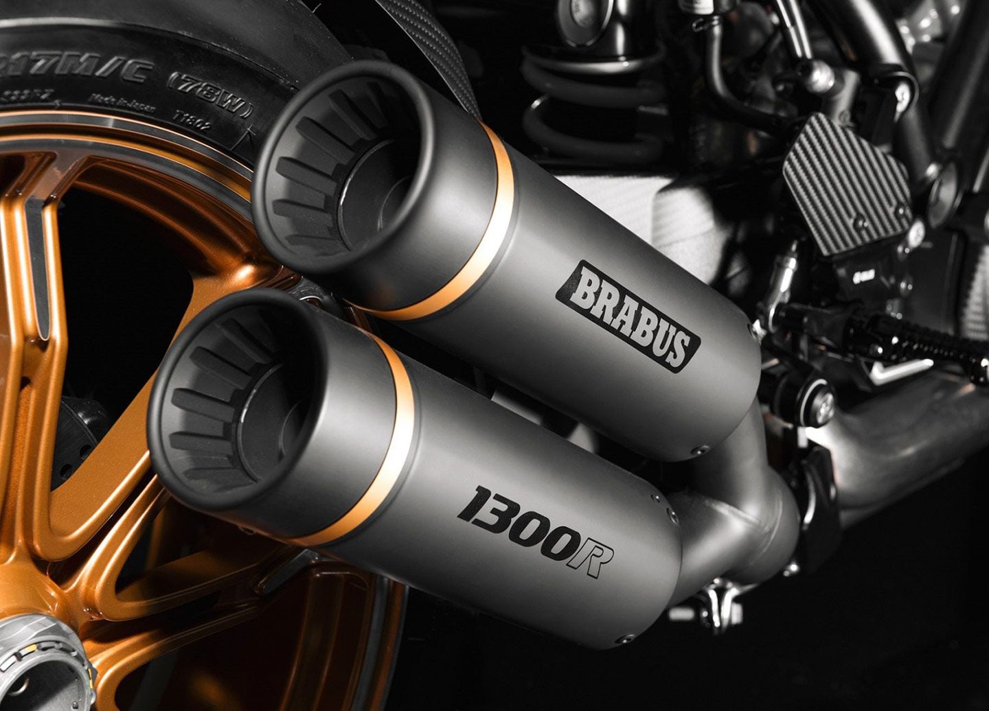 The Brabus dual-pipe slip-on exhaust gets gold accents on the mufflers, with the model name laser-etched on the bottom unit.