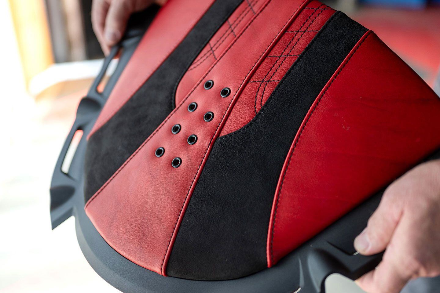 Details matter: meticulous work on the contemporary-style saddle, courtesy of Guys Upholstery.