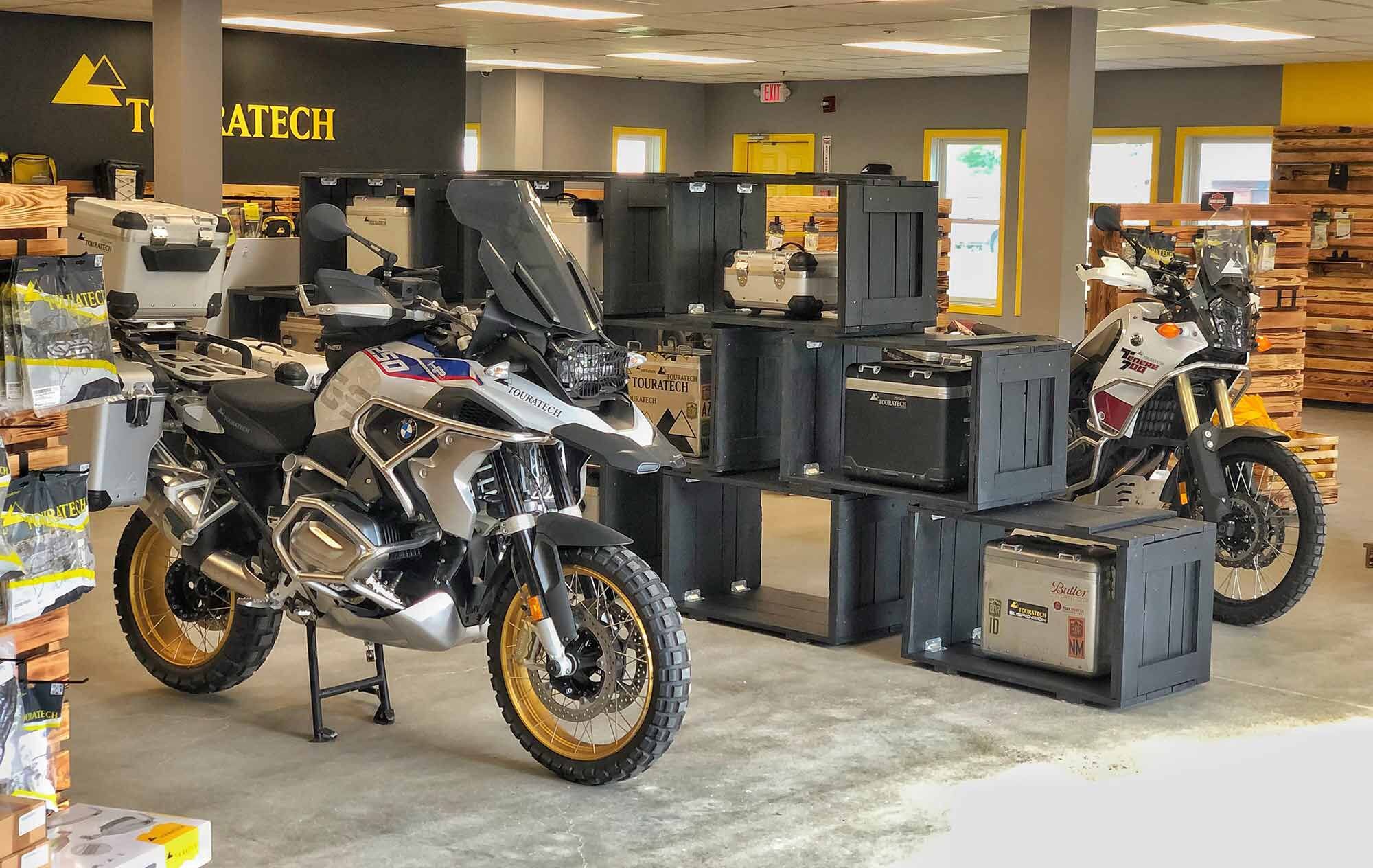 What would an adventure motorcycle shop be without adventure bikes on display? Two favorites, a BMW R 1250 GS and Yamaha Ténéré 700, are featured here, decked out in Touratech parts.