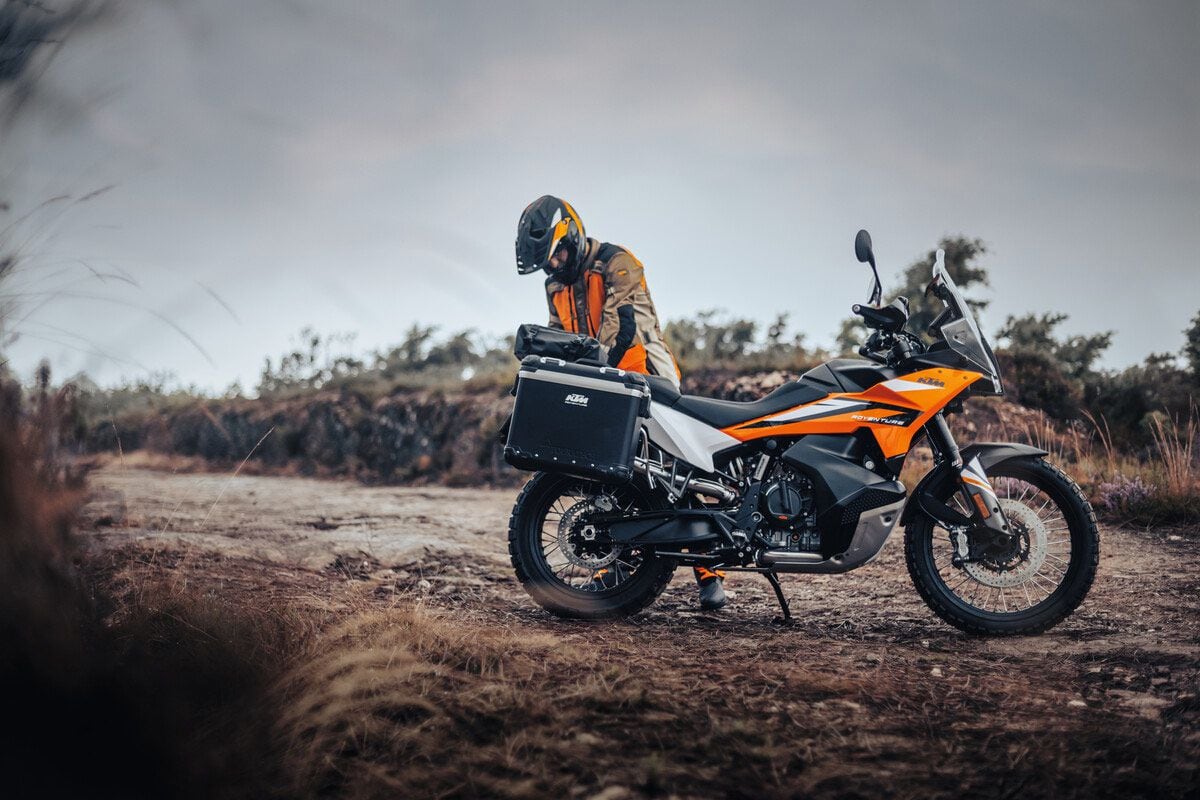 The base-model 890 is still more than capable of hanging tough off-road. For 2023, KTM adds more value to the base model by using adjustable suspension that’s not overly off-road biased. For many riders, that will make it a better all-rounder. It includes a taller windscreen; a lower, adjustable seat; and a conventional  front fender. It’s also less expensive. Accessory luggage pictured.
