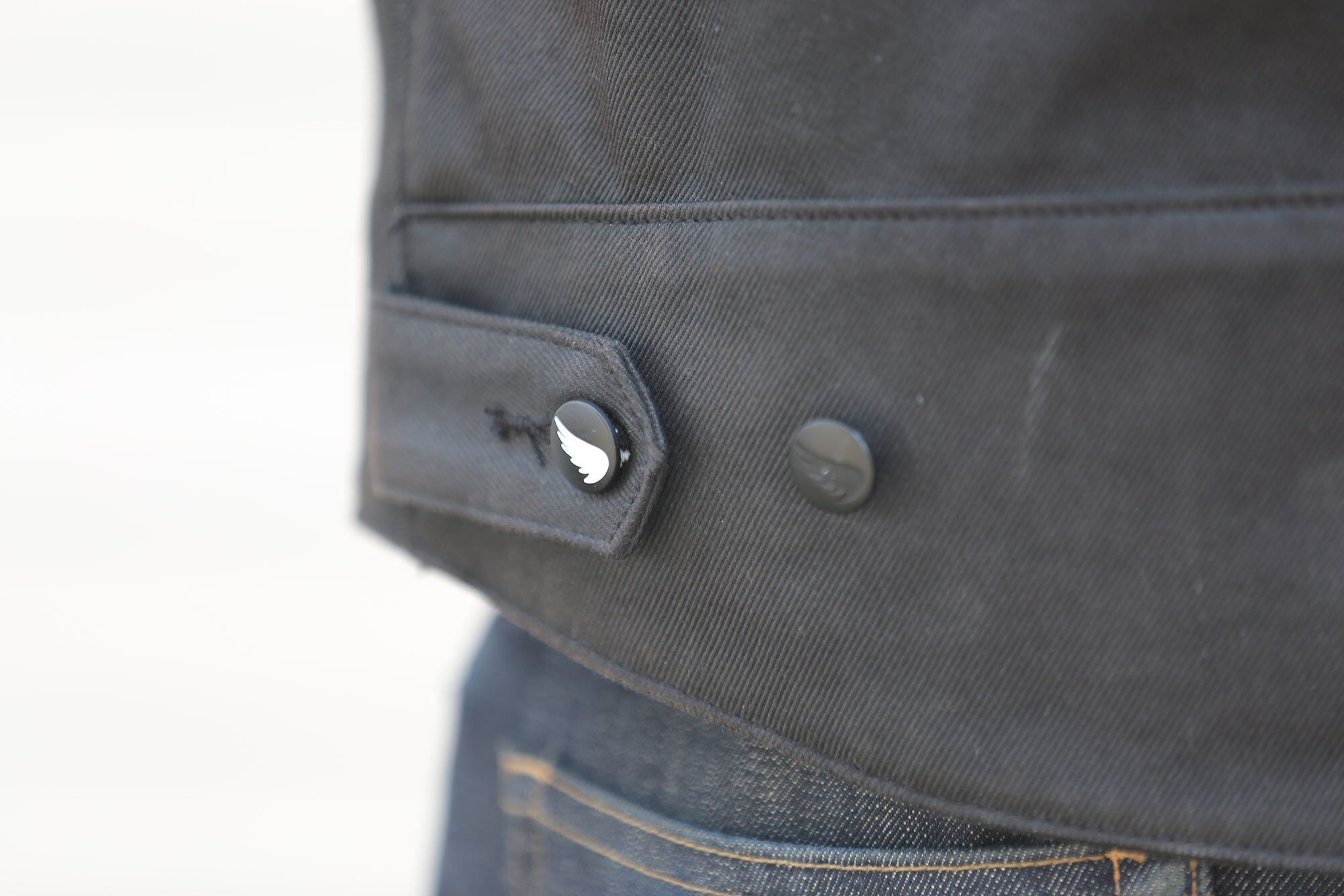Branded buttons on the back of the Saint Unbreakable jacket let the wearer adjust fit.
