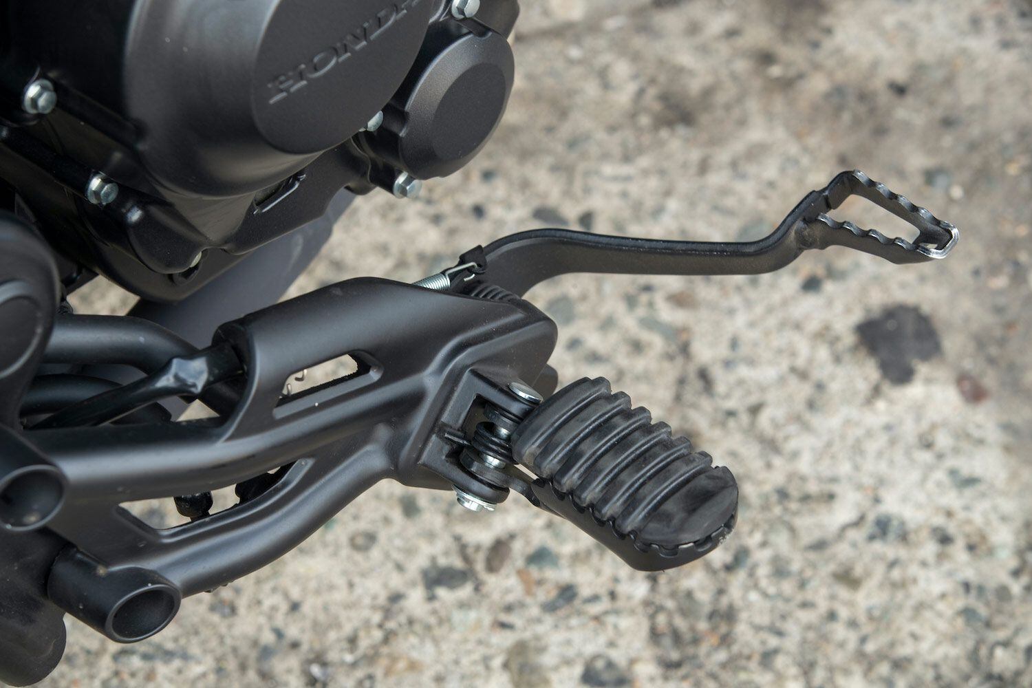 A close-up of the Rebel’s brake pedal and right peg.