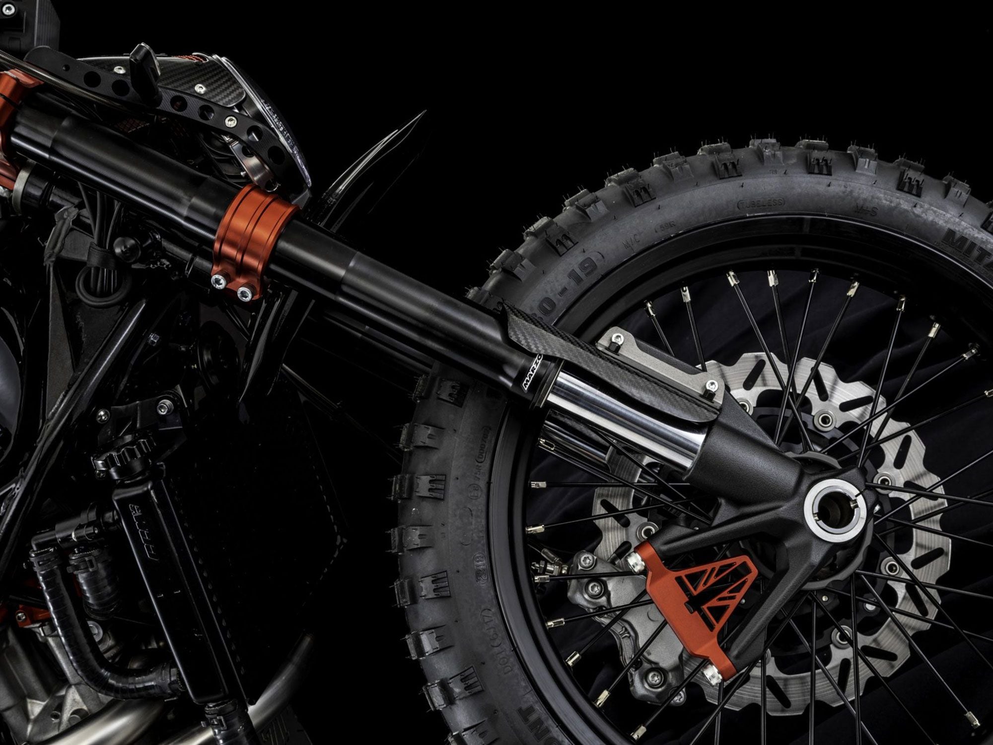 The scrambler-appropriate spoke wheels—19 inches in front, 17 out back—wear blocky dual sport rubber from Mitas.