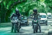 2024 Kawasaki Ninja e 1 and Z e 1 stopped at traffic light