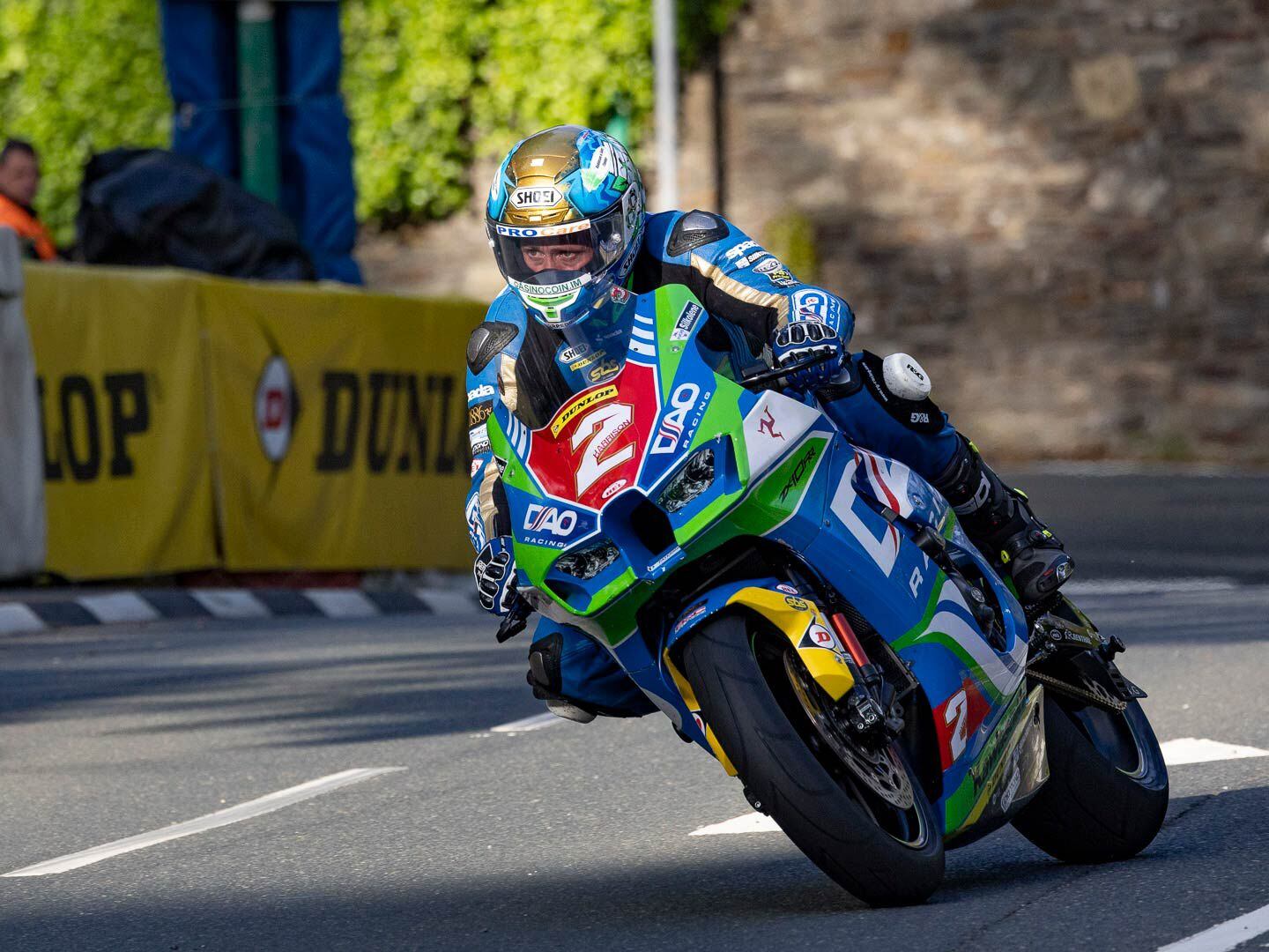 Dean Harrison, winner of the 2019 Senior TT, focuses on the exit of the turn and upcoming straight from the saddle of his DAO Racing Kawasaki 1000 Superstock.