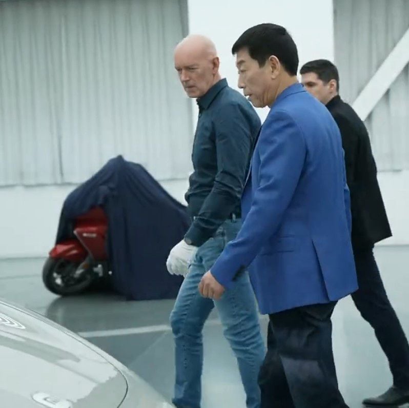 Chinese billionaire Wei Jianjun was recently seen on social media with the not-so-conspicuously-hidden touring machine set up in the background.