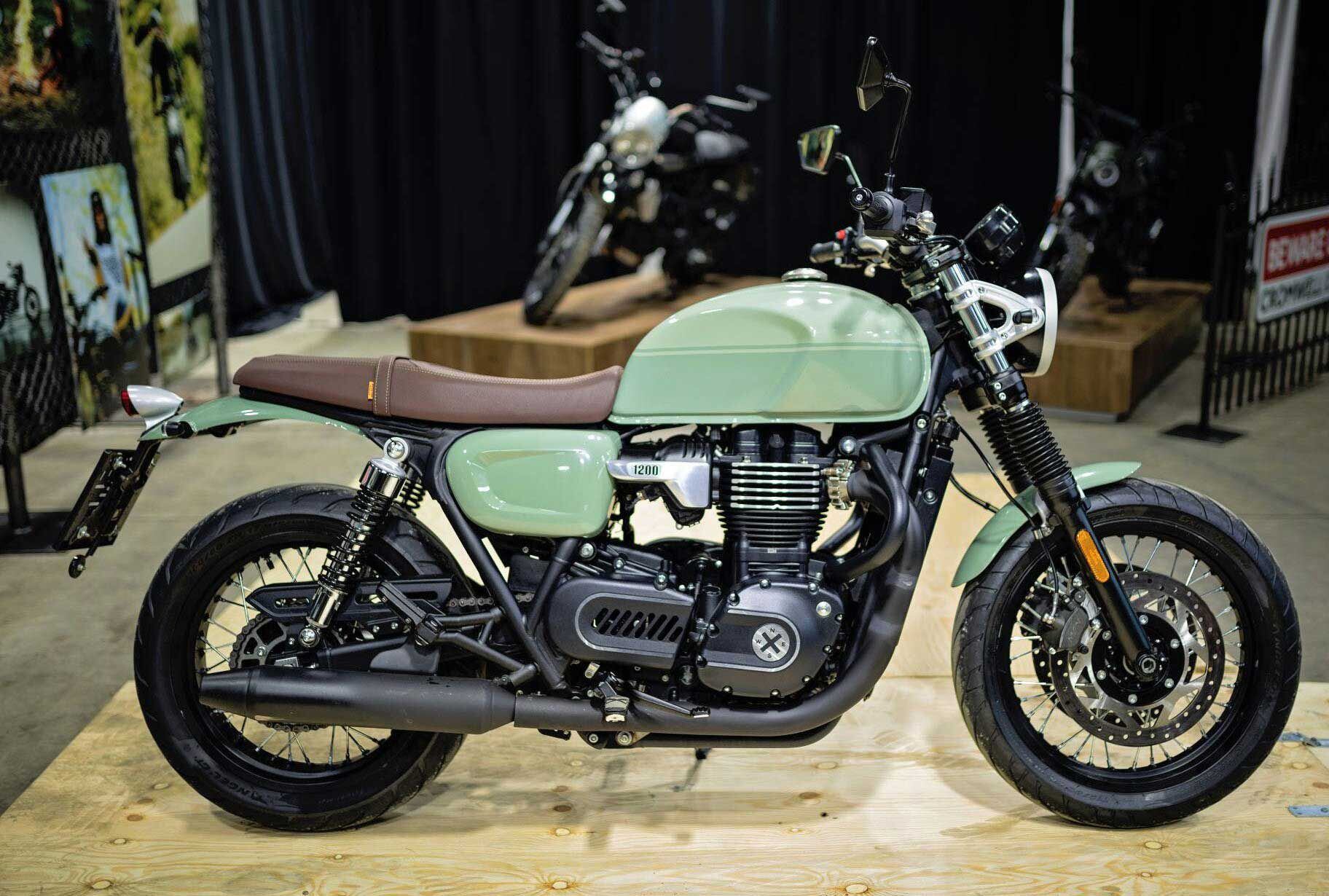 Brit-bike (and Bonneville) retro cues abound, from spoke wheels and exposed rear shocks to a bench saddle and tank knee pads.