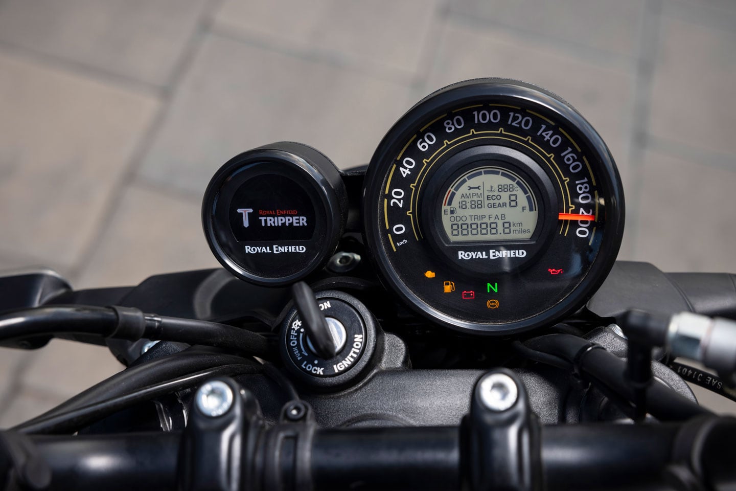 The dash on the base-model Guerrilla is an analog unit with an LCD info screen; the Tripper module on the left is standard equipment.